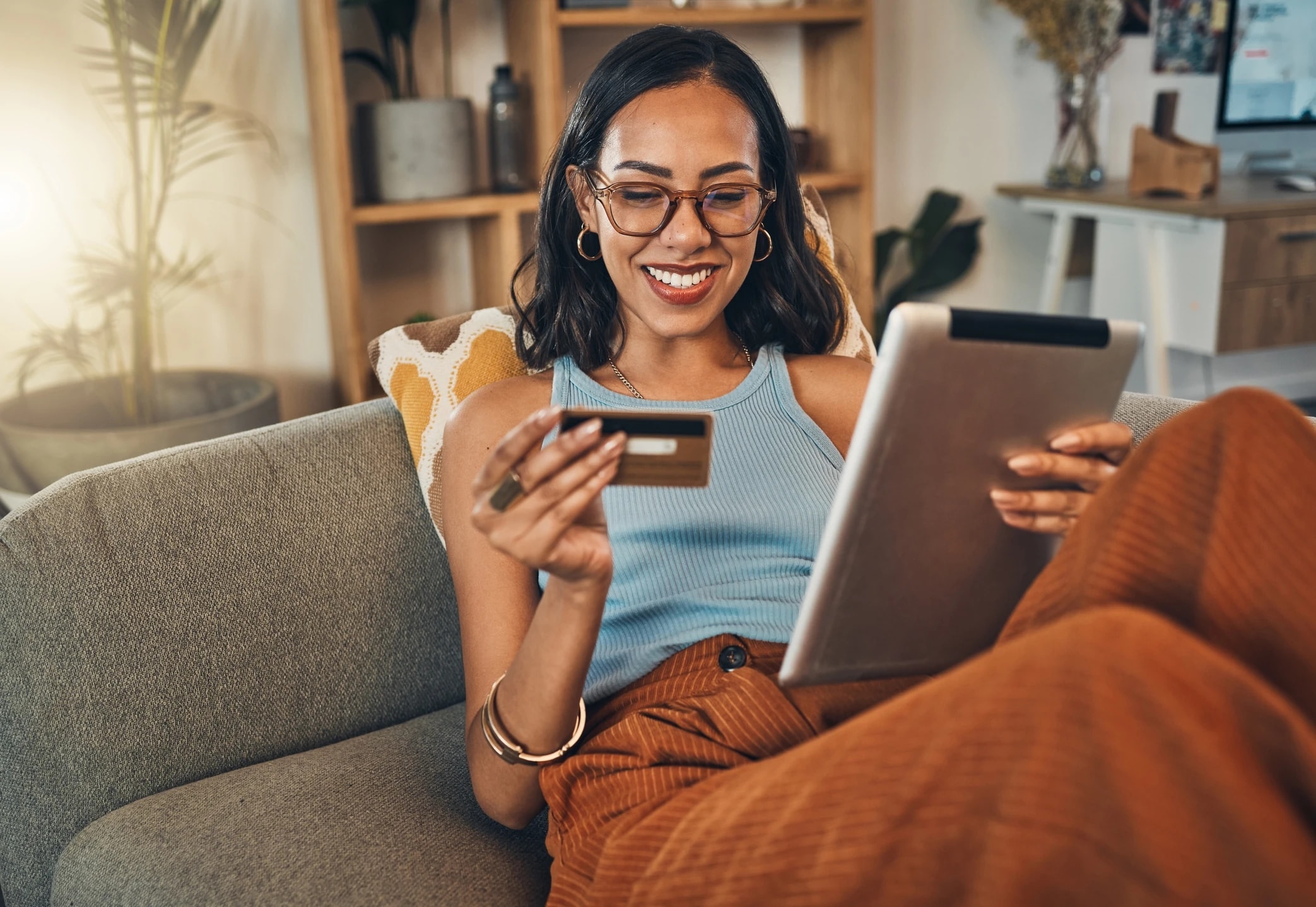 Woman paying by card on a tablet